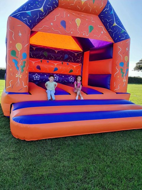 Brightly coloured party bouncy castle