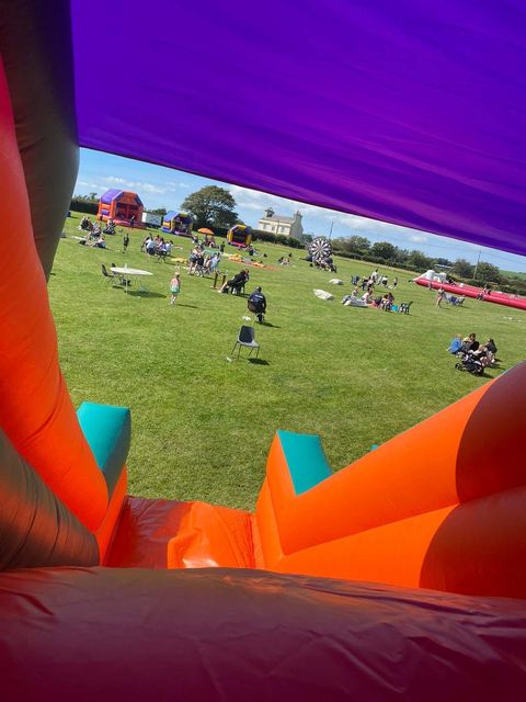 Looking out over the fun day field from the top of a slide