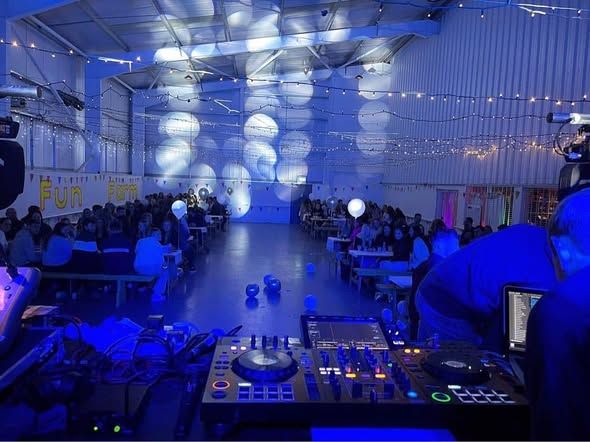 DJ decks with the hall and balloons behind