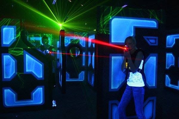A player firing a laser beam in the arena