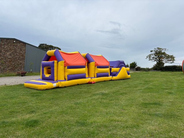 Yellow and purple inflatable obstacle course