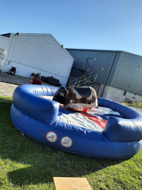 Inflatable rodeo bull ring beside the barns