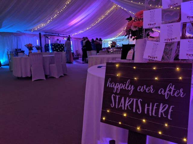 Lit sign reading happily ever after starts here